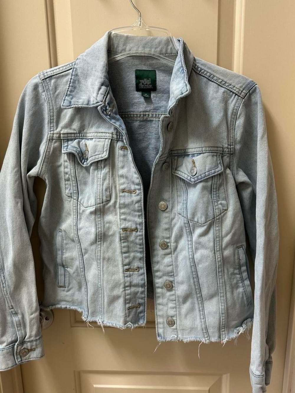 Blue ripped Jean denim jacket.